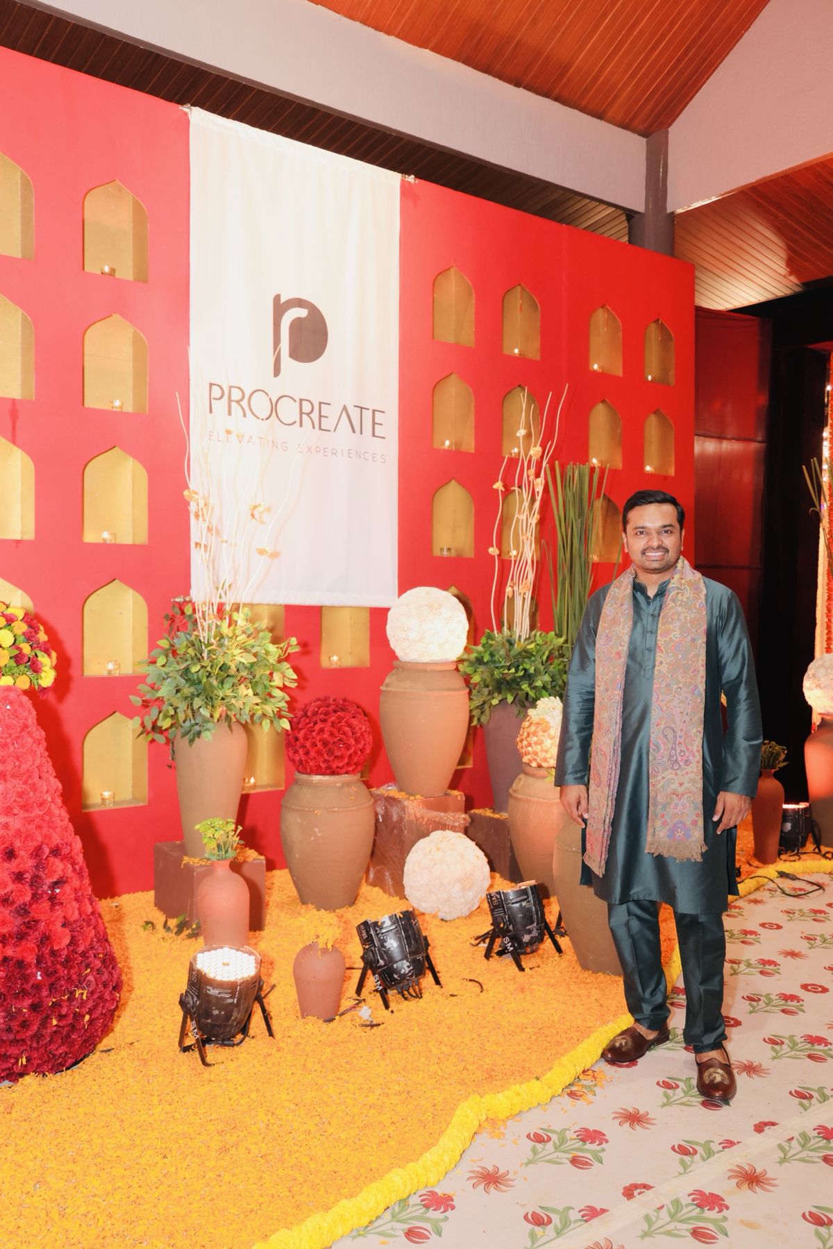Parv Parmar at a Procreate red jharokha and marigold set